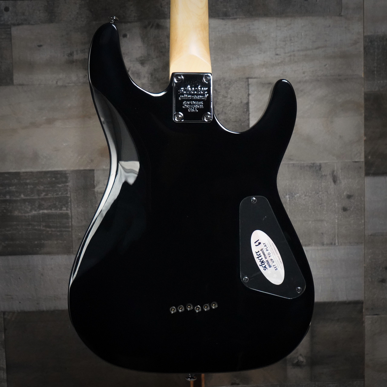 Schecter Omen-6 Left-Handed Electric Guitar in Gloss Black finish - dual humbuckers, contoured body, and hardware designed for left-handed players