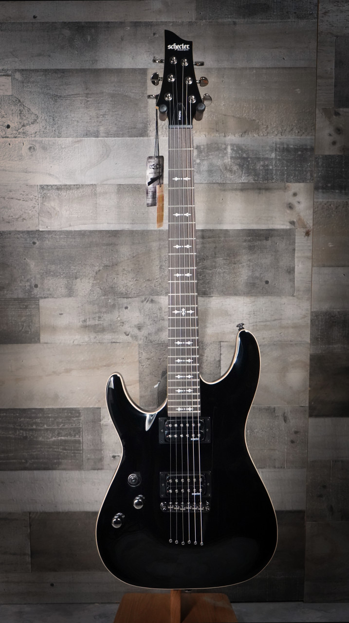 Schecter Omen-6 Left-Handed Electric Guitar in Gloss Black finish - dual humbuckers, contoured body, and hardware designed for left-handed players