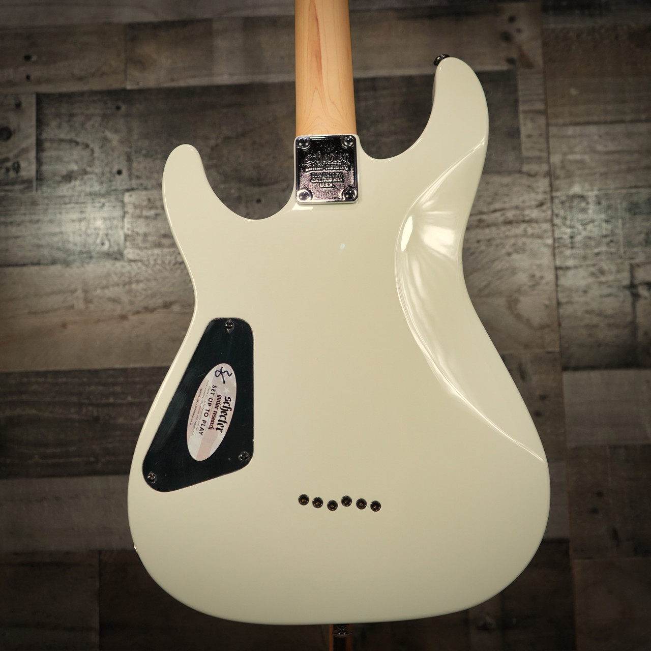 Schecter Omen-6 Electric Guitar in Vintage White finish - B-Stock model featuring dual humbuckers, black hardware, and classic double-cutaway bodySchecter Omen-6 Electric Guitar in Vintage White finish - B-Stock model featuring dual humbuckers, black hardware, and classic double-cutaway body