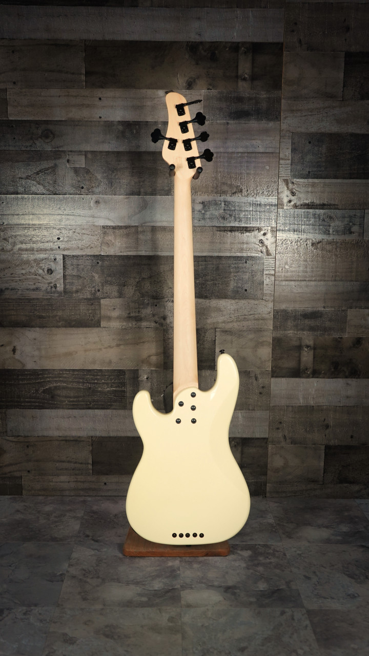 Schecter P-5 Ivy 5-string electric bass featuring a sleek ivy green finish, classic P-style body, powerful pickups, smooth-playing neck, and extended low-range performance.