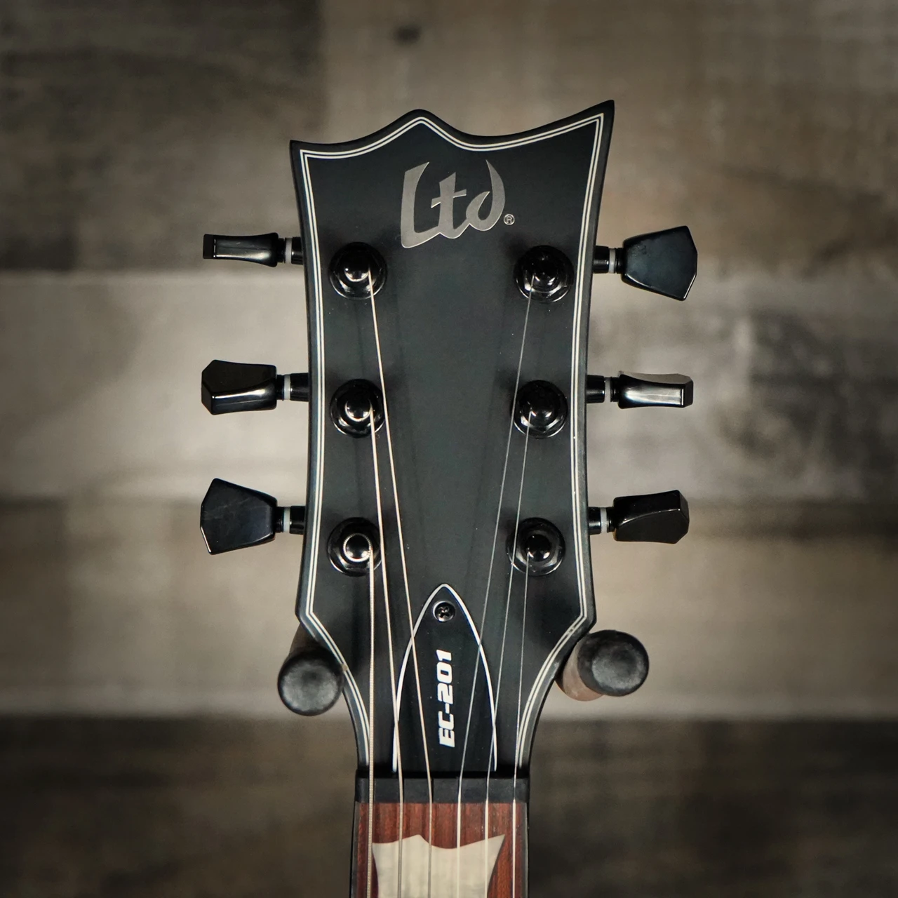 ESP LTD EC-201 Electric Guitar in Black Satin finish â€“ single-cutaway body with mahogany construction, humbucker pickup, and sleek minimalist design