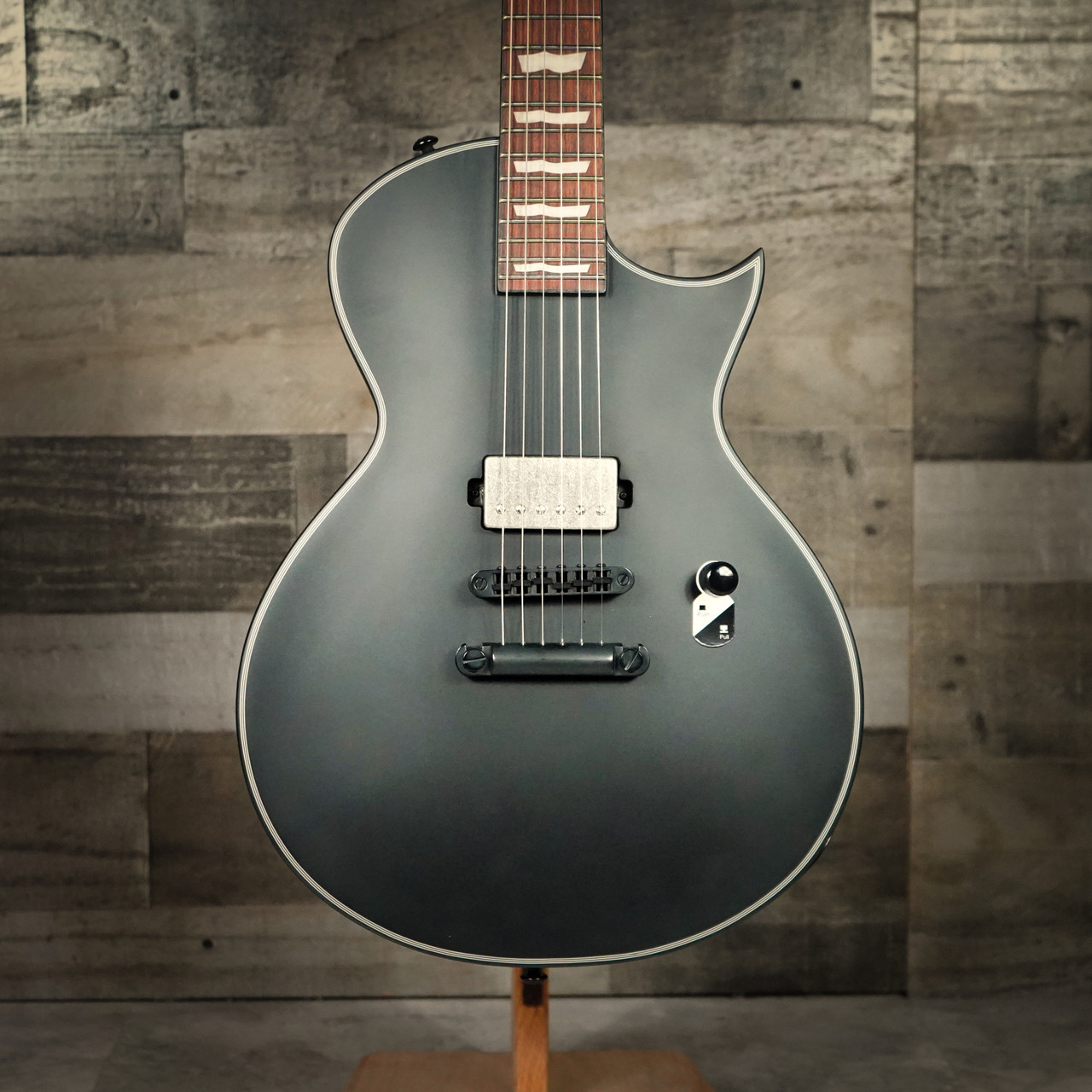 ESP LTD EC-201 Electric Guitar in Black Satin finish â€“ single-cutaway body with mahogany construction, humbucker pickup, and sleek minimalist design