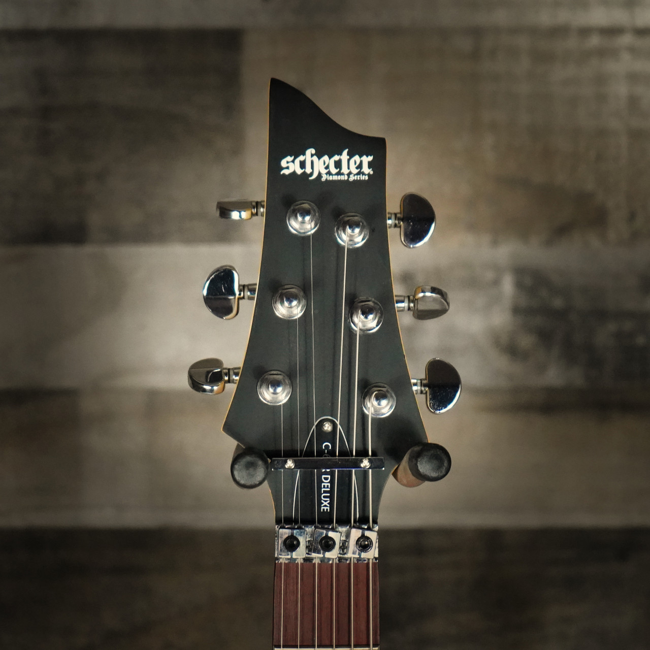 Schecter C-6 FR Deluxe LH Electric Guitar in Satin Black finish - left-handed B-Stock model featuring Floyd Rose bridge, dual humbuckers, and contoured body design