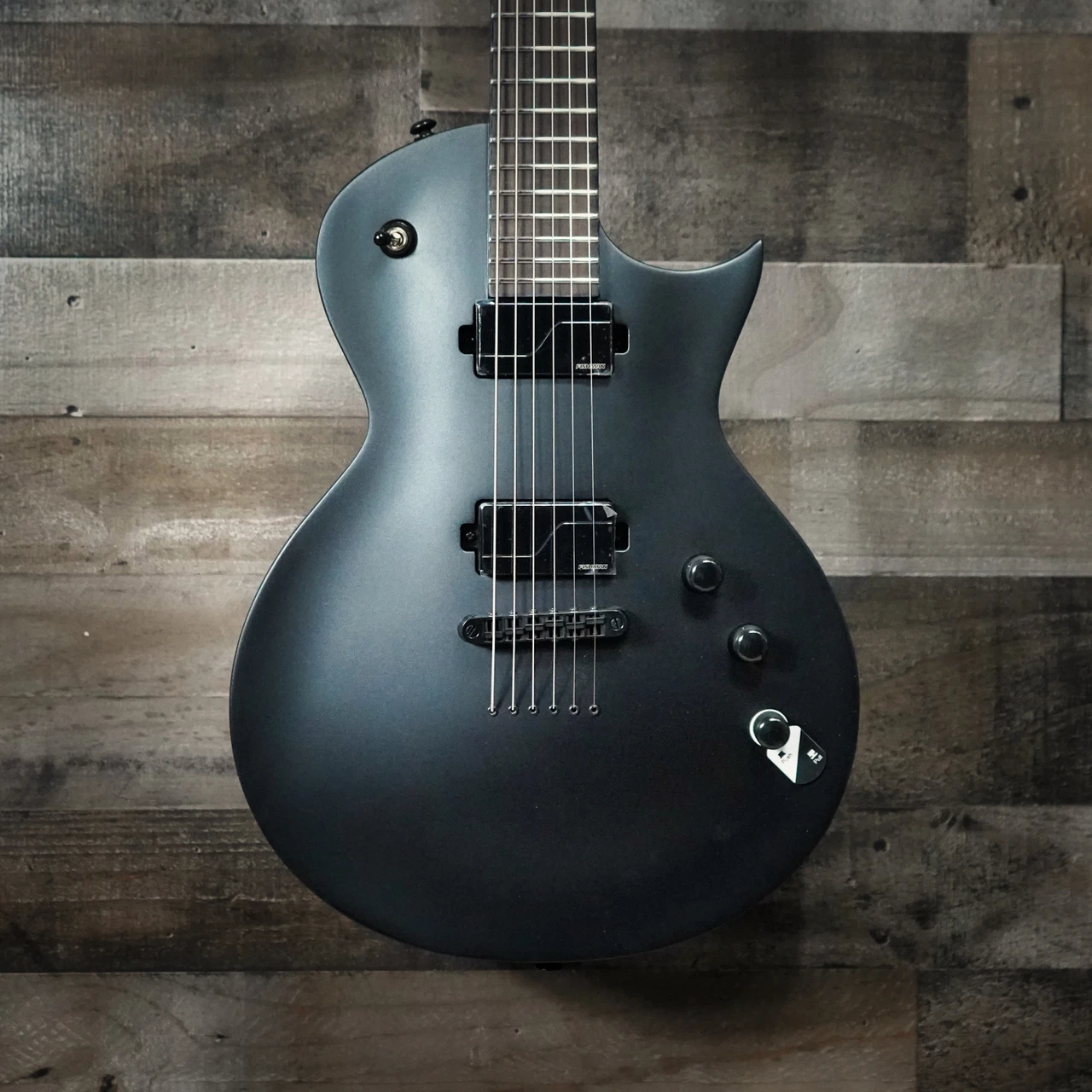 ESP LTD EC-1000 Baritone Electric Guitar in Charcoal Metallic Satin finish â€“ single-cutaway body with EMG pickups, extended scale neck, and matte hardware