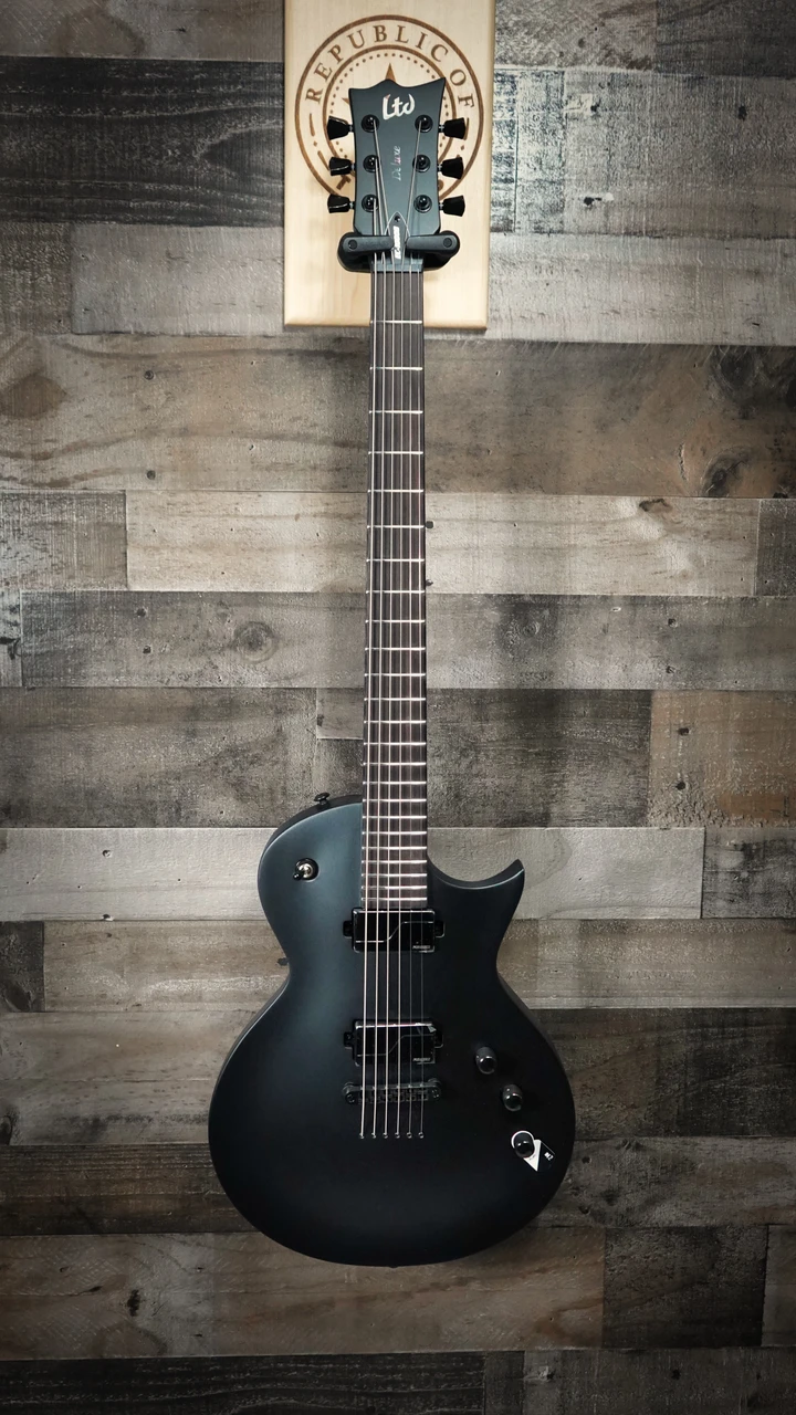 ESP LTD EC-1000 Baritone Electric Guitar in Charcoal Metallic Satin finish â€“ single-cutaway body with EMG pickups, extended scale neck, and matte hardware