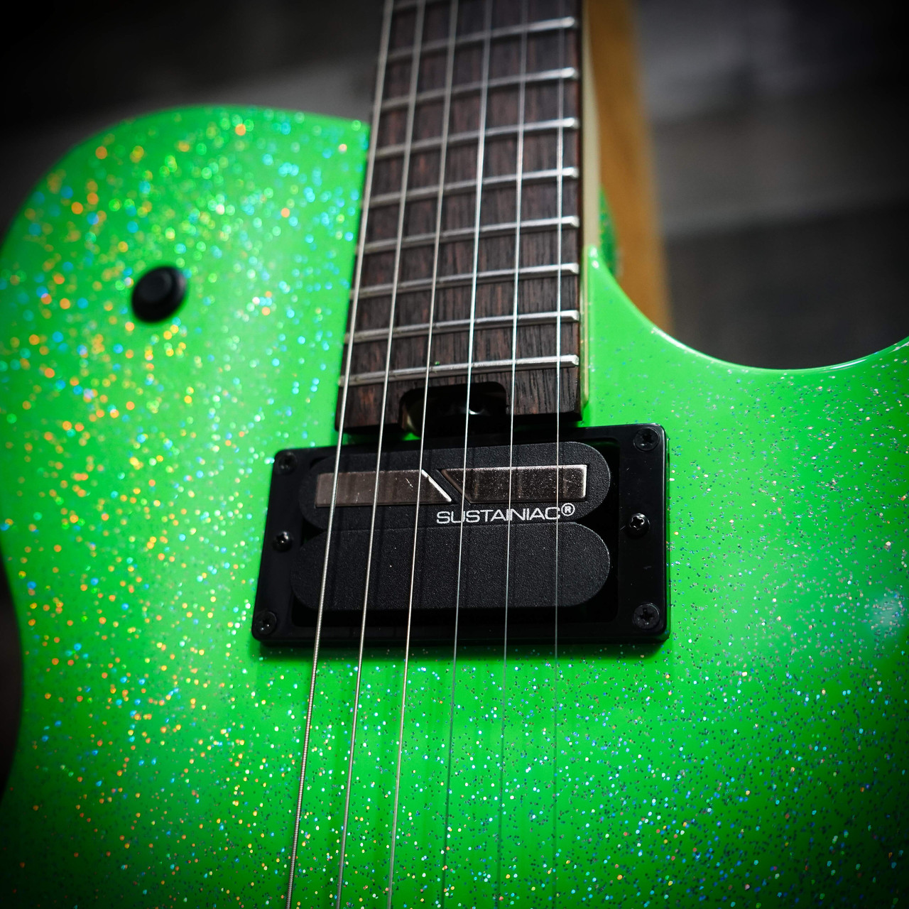 Cort Manson Alien Sparkle Electric Guitar – silver metallic finish with Sustainiac neck pickup and built-in XY Pad for tone and MIDI control, front angled view