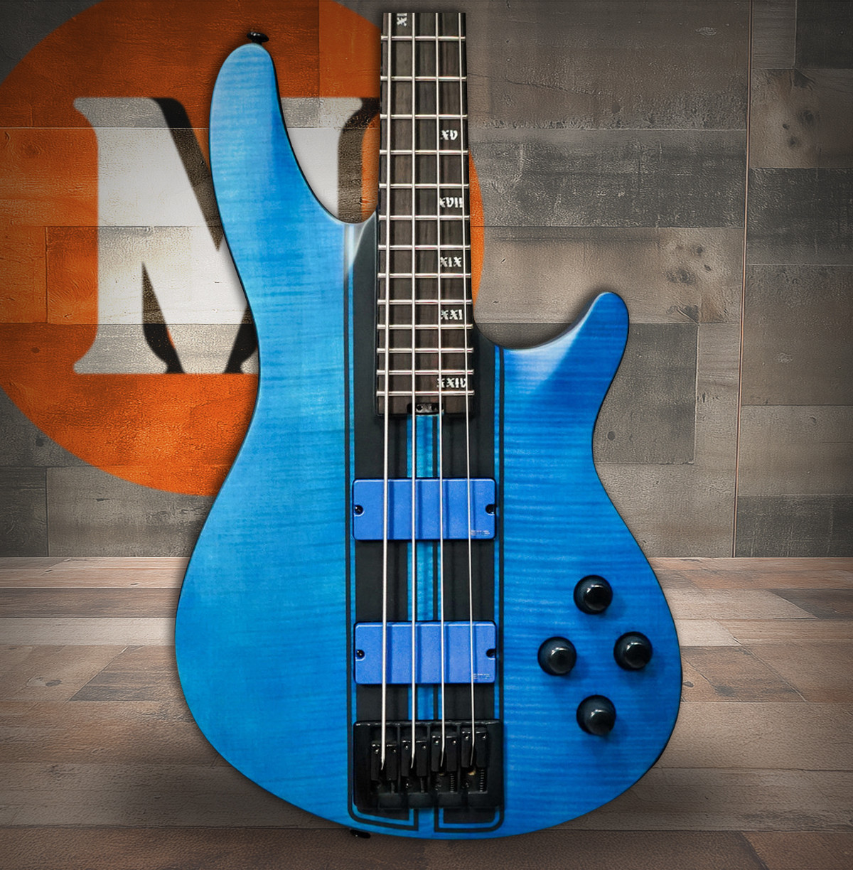 Schecter C-4 GT electric bass in Satin Trans Blue featuring a black racing stripe decal, active pickups and electronics, contoured body design, ultra-fast neck, and modern high-output performance.