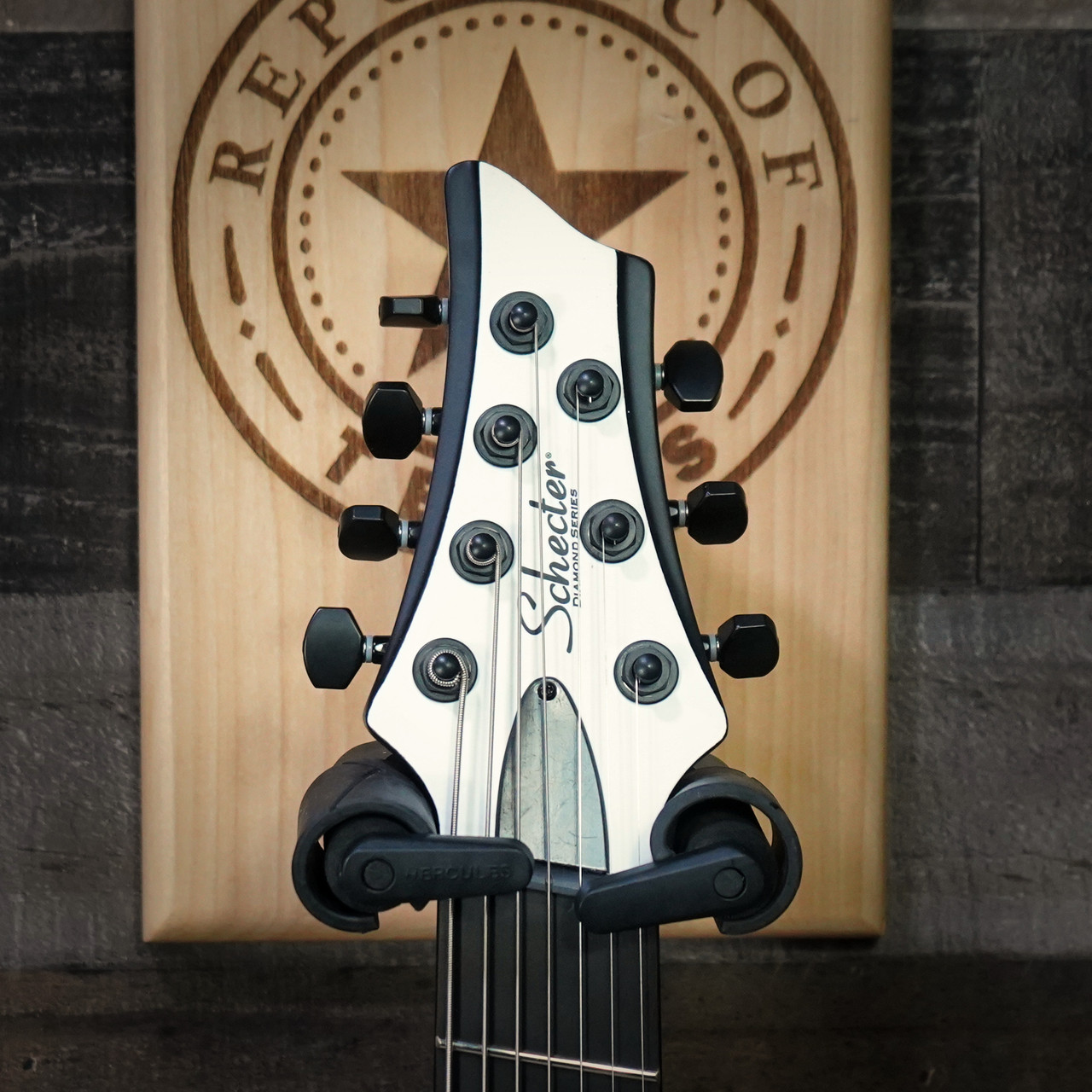 Schecter C-7 Contrasts Rob Scallon 7-String Multiscale guitar featuring a dual white/black finish, multi-scale ebony fingerboard, signature pickups, lightweight body, and signature Rob Scallon design elements.