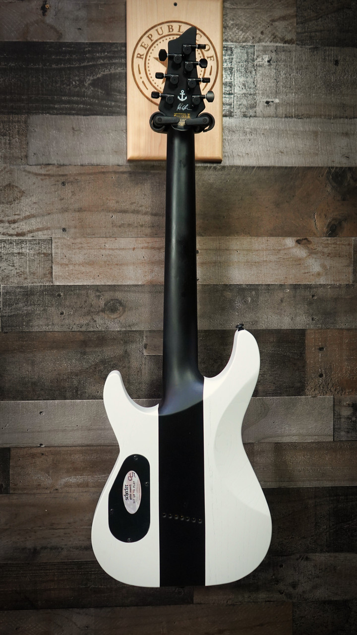 Schecter C-7 Contrasts Rob Scallon 7-String Multiscale guitar featuring a dual white/black finish, multi-scale ebony fingerboard, signature pickups, lightweight body, and signature Rob Scallon design elements.