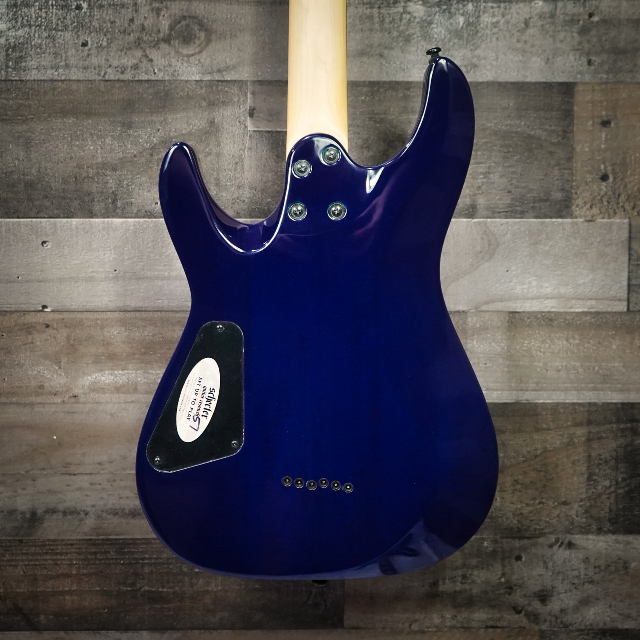 The Schecter C-6 Elite Aqua Burst (782) showcases a vivid Aqua Burst finish over a quilted maple top, delivering a boutique-inspired look with excellent resonance. Its thin-C neck offers smooth, fast playability, while Diamond Series humbuckers provide punchy, balanced tones suitable for rock, metal, blues, and everyday practice. A stylish and reliable choice for players seeking their first high-quality electric guitar or an affordable performance-ready instrument.