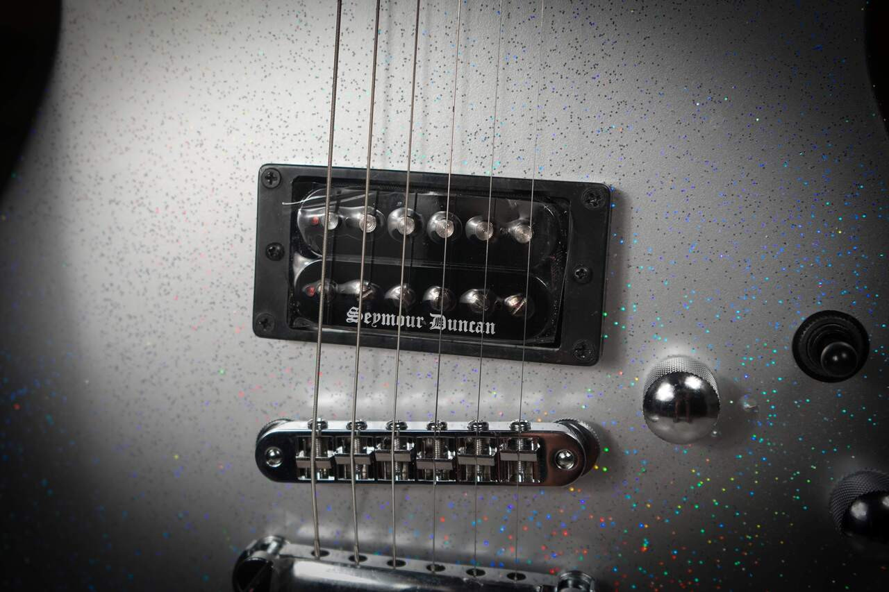 Cort Manson Silver Rainbow Electric Guitar – metallic silver finish with Sustainiac neck pickup and Seymour Duncan Black Winter bridge pickup, front angled view