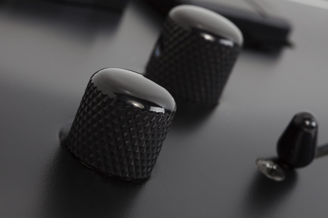 The Schecter C-1 SLS Evil Twin (1347) features a sleek Satin Black finish matched with a fast ultra-thin neck and lightweight SLS construction for maximum speed and comfort. High-output active pickups deliver crushing metal tones with clarity and sustain, while premium hardware ensures tuning stability under aggressive playing. Built for modern metal and progressive musicians who demand precision and power.