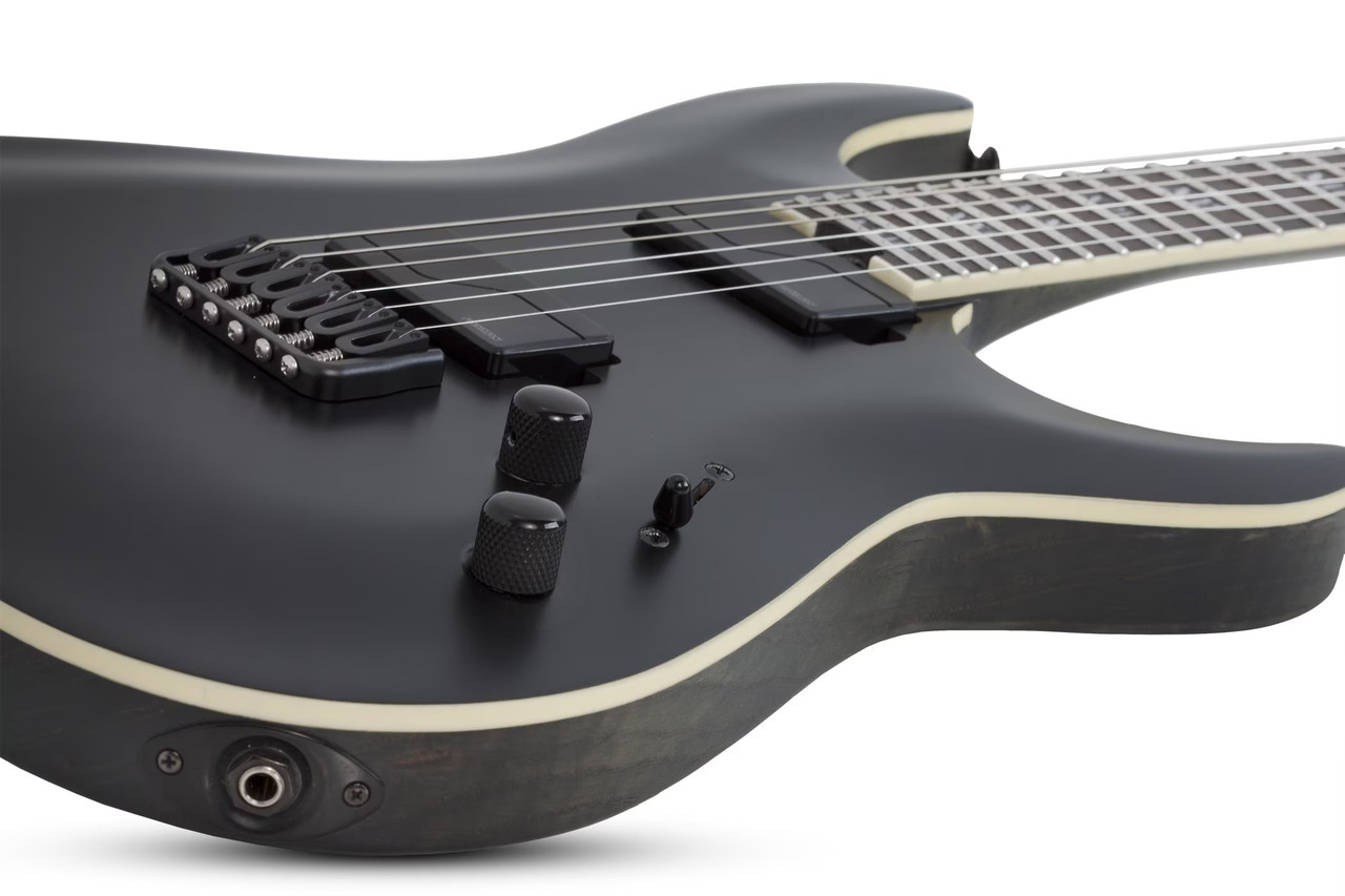 The Schecter C-1 SLS Evil Twin (1347) features a sleek Satin Black finish matched with a fast ultra-thin neck and lightweight SLS construction for maximum speed and comfort. High-output active pickups deliver crushing metal tones with clarity and sustain, while premium hardware ensures tuning stability under aggressive playing. Built for modern metal and progressive musicians who demand precision and power.