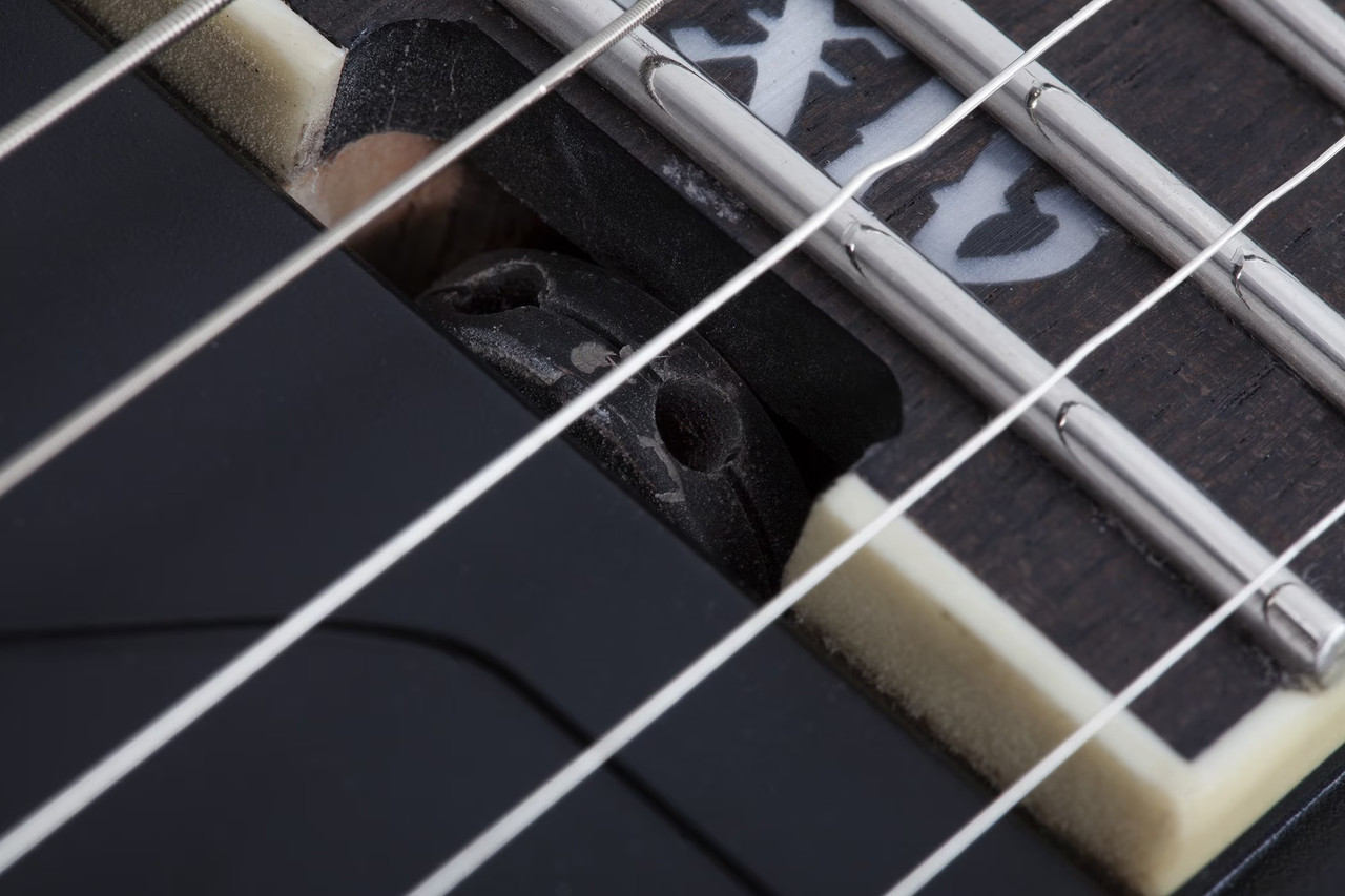 The Schecter C-1 SLS Evil Twin (1347) features a sleek Satin Black finish matched with a fast ultra-thin neck and lightweight SLS construction for maximum speed and comfort. High-output active pickups deliver crushing metal tones with clarity and sustain, while premium hardware ensures tuning stability under aggressive playing. Built for modern metal and progressive musicians who demand precision and power.