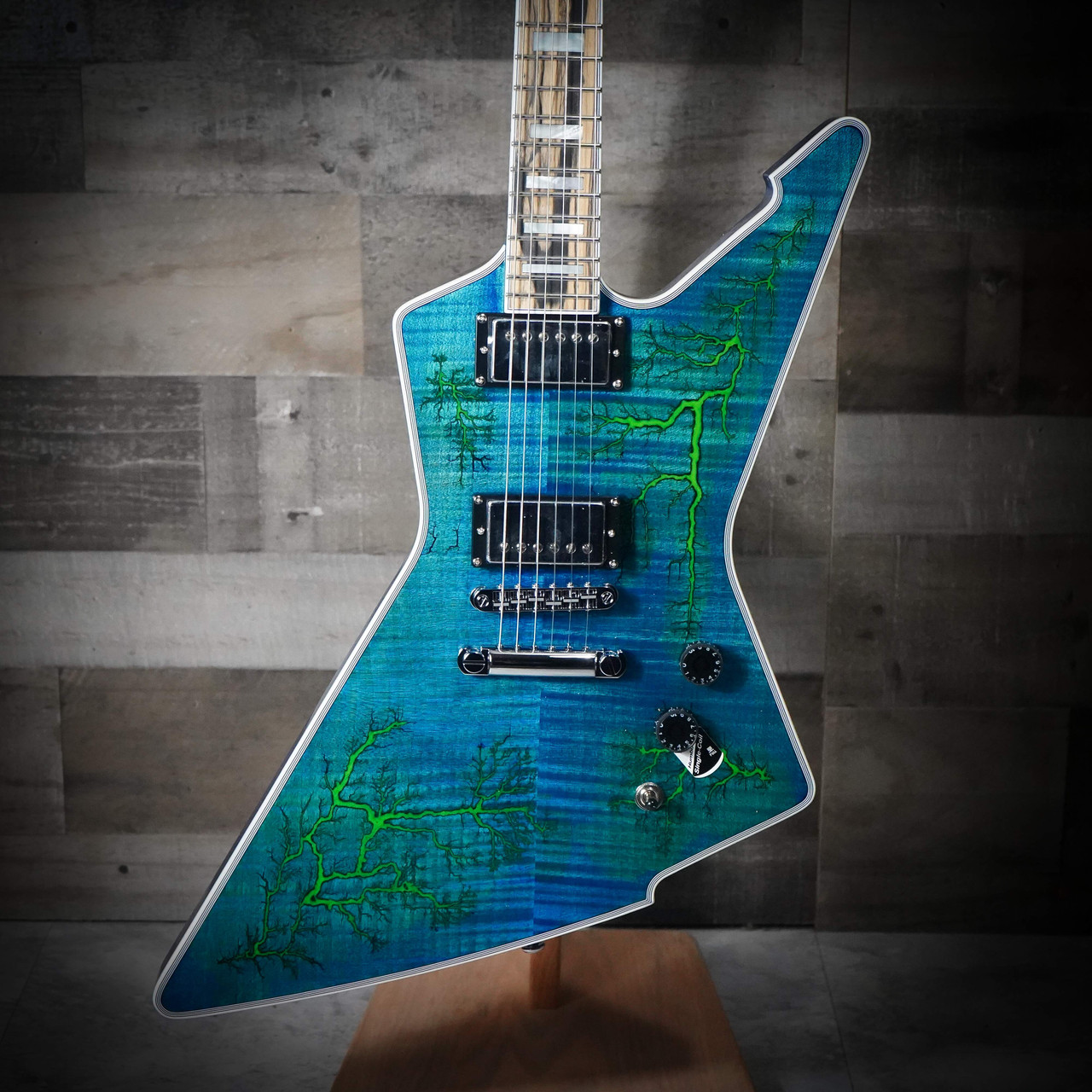 The Schecter E-1 Electro Resin (603) showcases a unique Yellow Electro Resin/Natural finish over a dramatically shaped E-1 body. Its eye-catching resin top provides a boutique look, while the lightweight body and thin-C neck ensure fast, comfortable playability. Equipped with powerful Schecter humbuckers, this guitar delivers tight lows, cutting highs, and excellent sustainÃ¢â‚¬â€ideal for modern rock, metal, and players wanting a standout stage instrument.