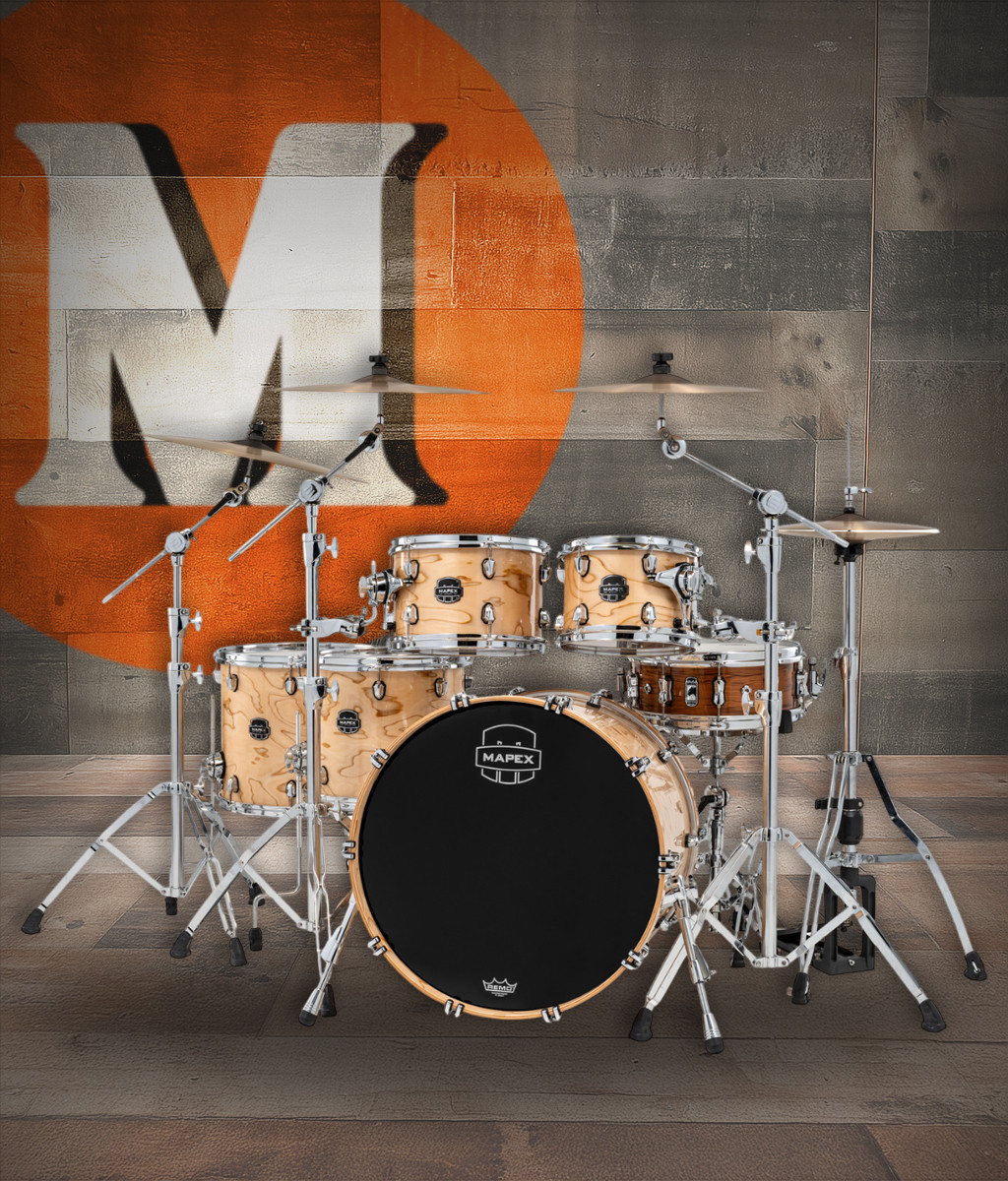 The Mapex Saturn VI Studioease 5-Piece Shell Pack (SR628XUZXN) features hybrid maple/walnut shells for enhanced tone, projection, and dynamic response. Finished in a premium Exotic Natural Burl, this kit offers a warm low-end, smooth mids, and articulate highs. SONIClear bearing edges improve tuning consistency and head-to-shell contact, making this shell pack ideal for studio recording and professional live performance.