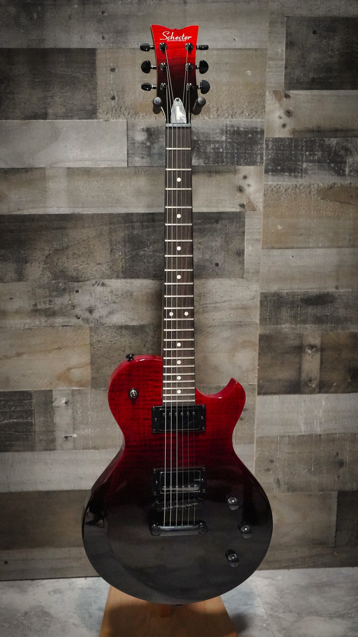 The Schecter Solo-II Standard (3960) in Blood Burst features a carved top, mahogany body, and a fast thin-C neck for smooth, effortless playability. Its high-output humbuckers deliver aggressive punch and rich sustain, while the Blood Burst finish adds a dramatic, modern aesthetic. A great choice for rock, metal, and lead players wanting powerful tone and premium build quality.