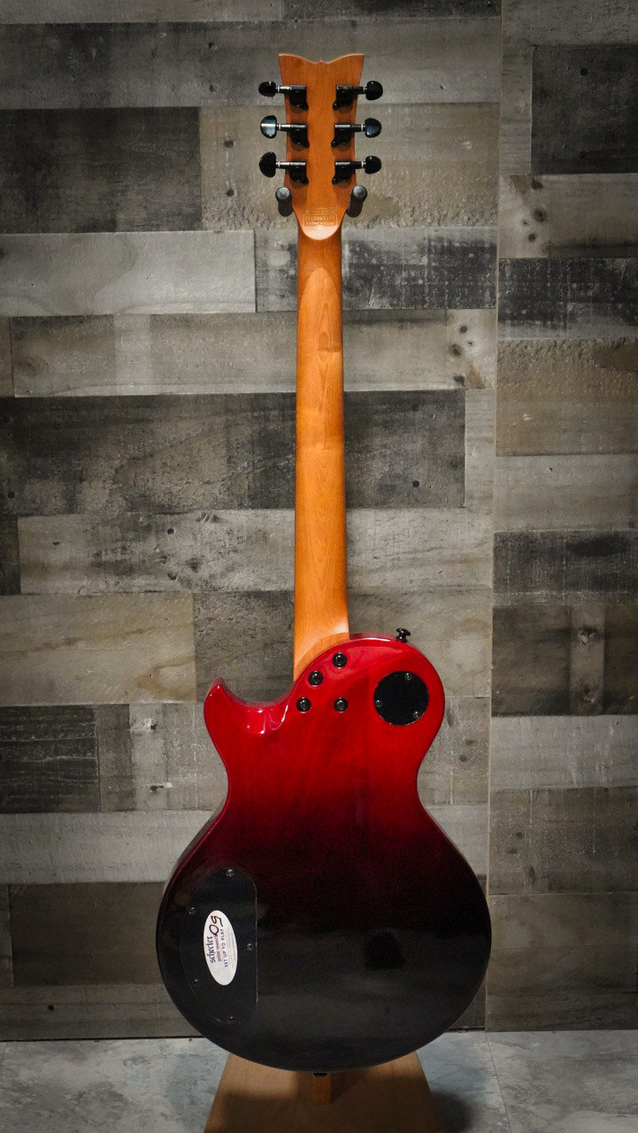 The Schecter Solo-II Standard (3960) in Blood Burst features a carved top, mahogany body, and a fast thin-C neck for smooth, effortless playability. Its high-output humbuckers deliver aggressive punch and rich sustain, while the Blood Burst finish adds a dramatic, modern aesthetic. A great choice for rock, metal, and lead players wanting powerful tone and premium build quality.