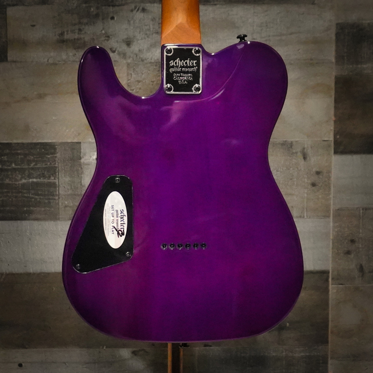 The Schecter PT Standard (3956) showcases a stunning burl top finished in Purple Burst, giving it boutique-level visual appeal. A comfortable Thin-C neck paired with Diamond Series pickups delivers crisp twang, tight lows, and rich midrange ideal for multiple genres. The P-s classic T-style silhouette combined with Schecterâ€™s modern build quality makes it a versatile, stage-ready instrument.