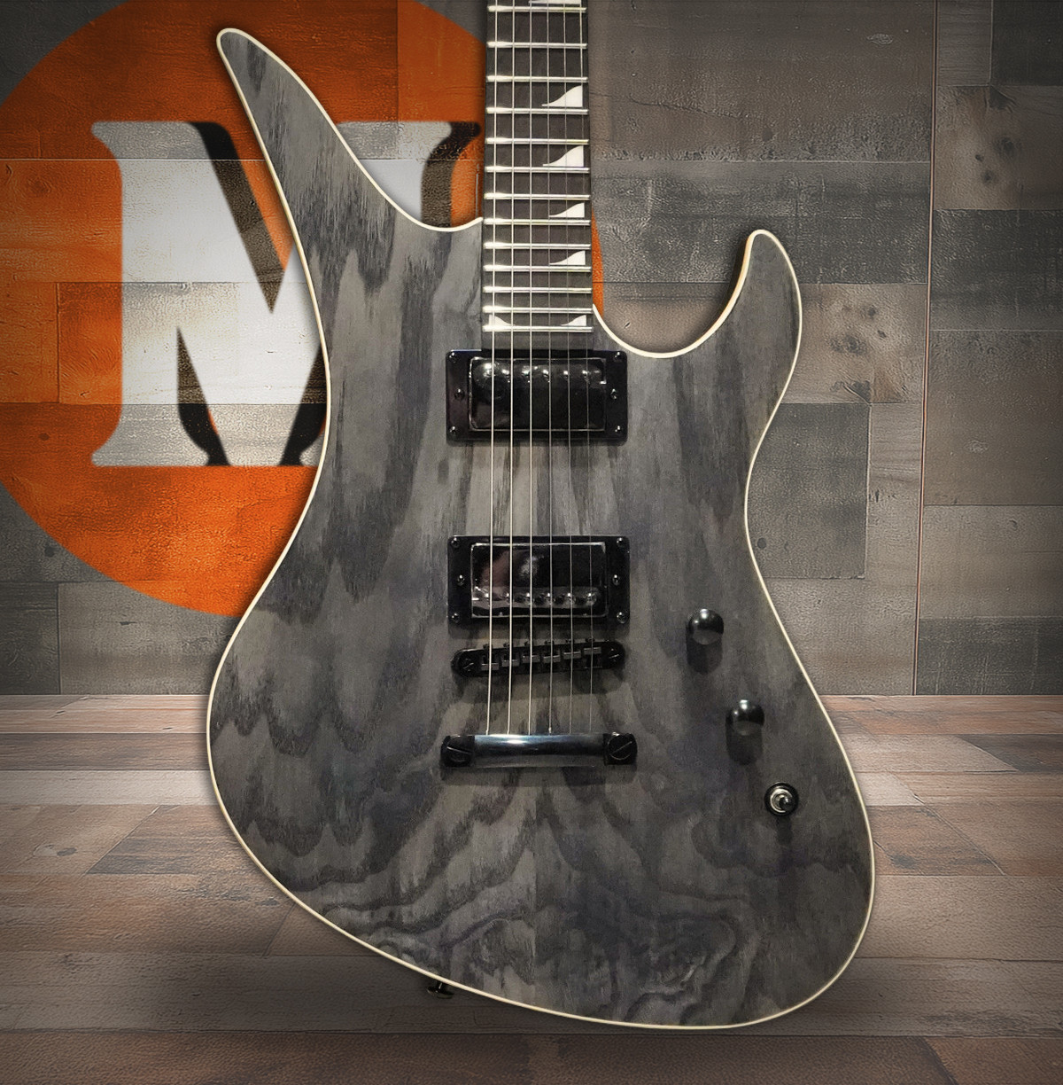 The Schecter Avenger Standard (3964) features a striking offset Avenger body finished in smooth Charcoal Satin. Equipped with powerful Diamond Series humbuckers, a thin-C neck for fast playability, and stable hardware, this guitar is built for aggressive riffing, soaring leads, and modern high-gain tones. Ideal for rock and metal players seeking performance-driven design with bold aesthetics.