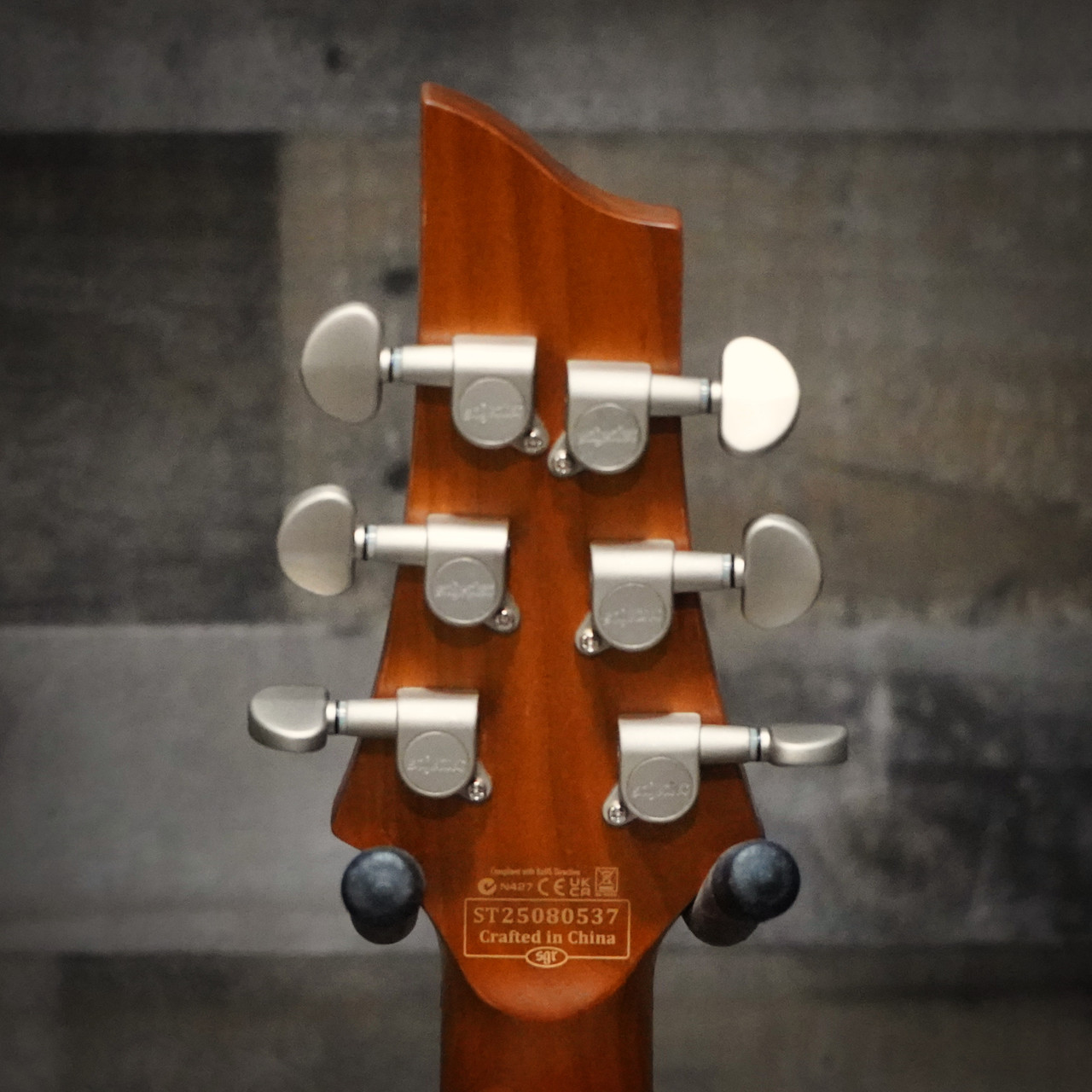 The Schecter C-1 Standard Plus (3935) showcases a striking quilted maple top under a Transparent Purple Burst finish, offering both eye-catching style and resonant tone. Equipped with Schecter Diamond Series humbuckers, a fast Thin-C neck, and dependable hardware, this guitar delivers powerful, articulate sound for rock, metal, and modern playing styles. A visually stunning and performance-ready instrument for players of all levels.