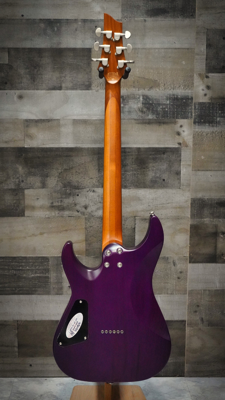 The Schecter C-1 Standard Plus (3935) showcases a striking quilted maple top under a Transparent Purple Burst finish, offering both eye-catching style and resonant tone. Equipped with Schecter Diamond Series humbuckers, a fast Thin-C neck, and dependable hardware, this guitar delivers powerful, articulate sound for rock, metal, and modern playing styles. A visually stunning and performance-ready instrument for players of all levels.