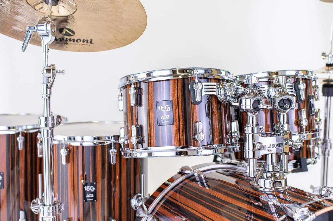 Sonor AQ2 150th Anniversary Shell Set – High Gloss Ebony Veneer (AQ2-Sonor ANN-WMCEBN) featuring hybrid maple/birch shells, chrome hardware, and limited-edition anniversary badging