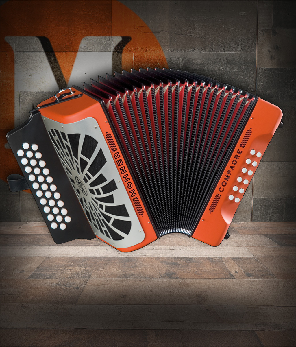 Hohner COGO-N Compadre GCF Accordion in Orange with silver grille, diatonic button layout, and included gig bag.