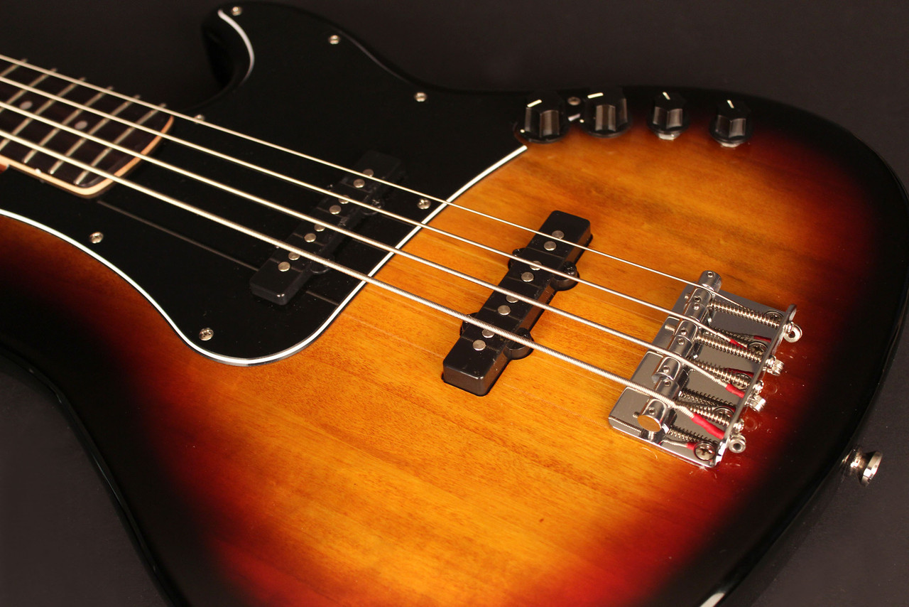 Cort GB34JJ3TS GB Series 4-String Bass Guitar in 3 Tone Sunburst finish with dual J-style pickups and active 2-band EQ.