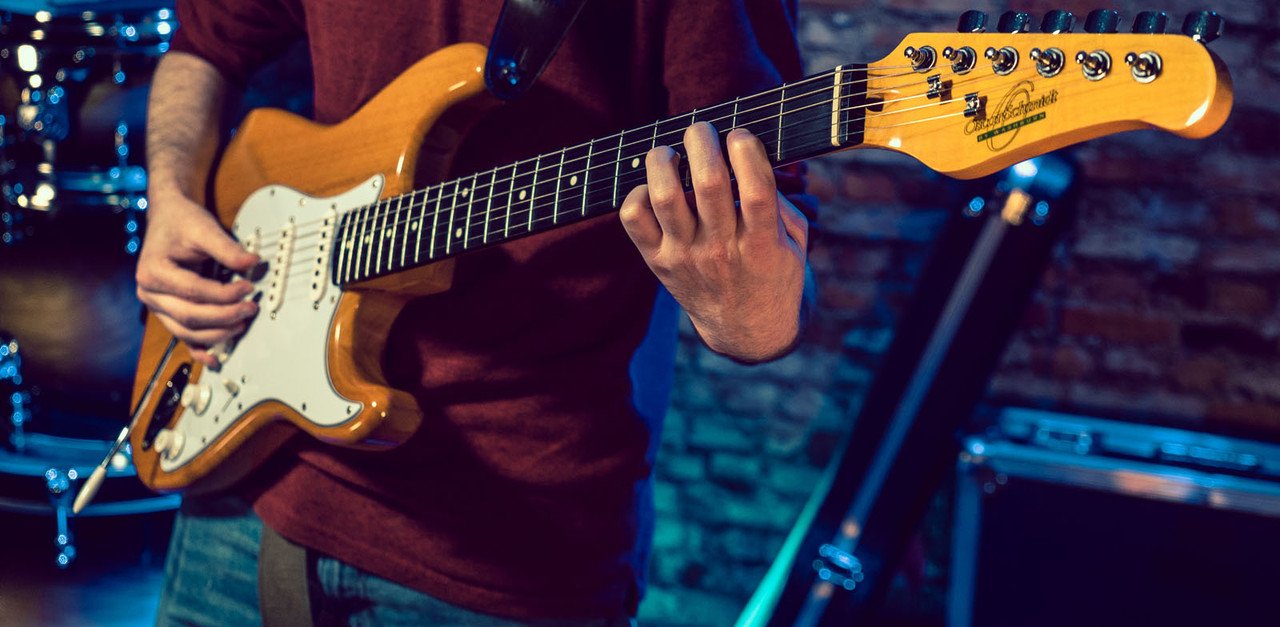 Oscar Schmidt OS-300-NH-A Double Cut Electric Guitar in Natural Finish with three single-coil pickups and maple neck.