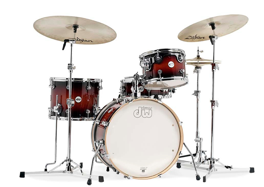 DW Design Frequent Flyer 4-Piece Drum Set in Tobacco Burst finish featuring 20" bass drum, maple shells, and compact professional setup â€“ available at Musician Madness.