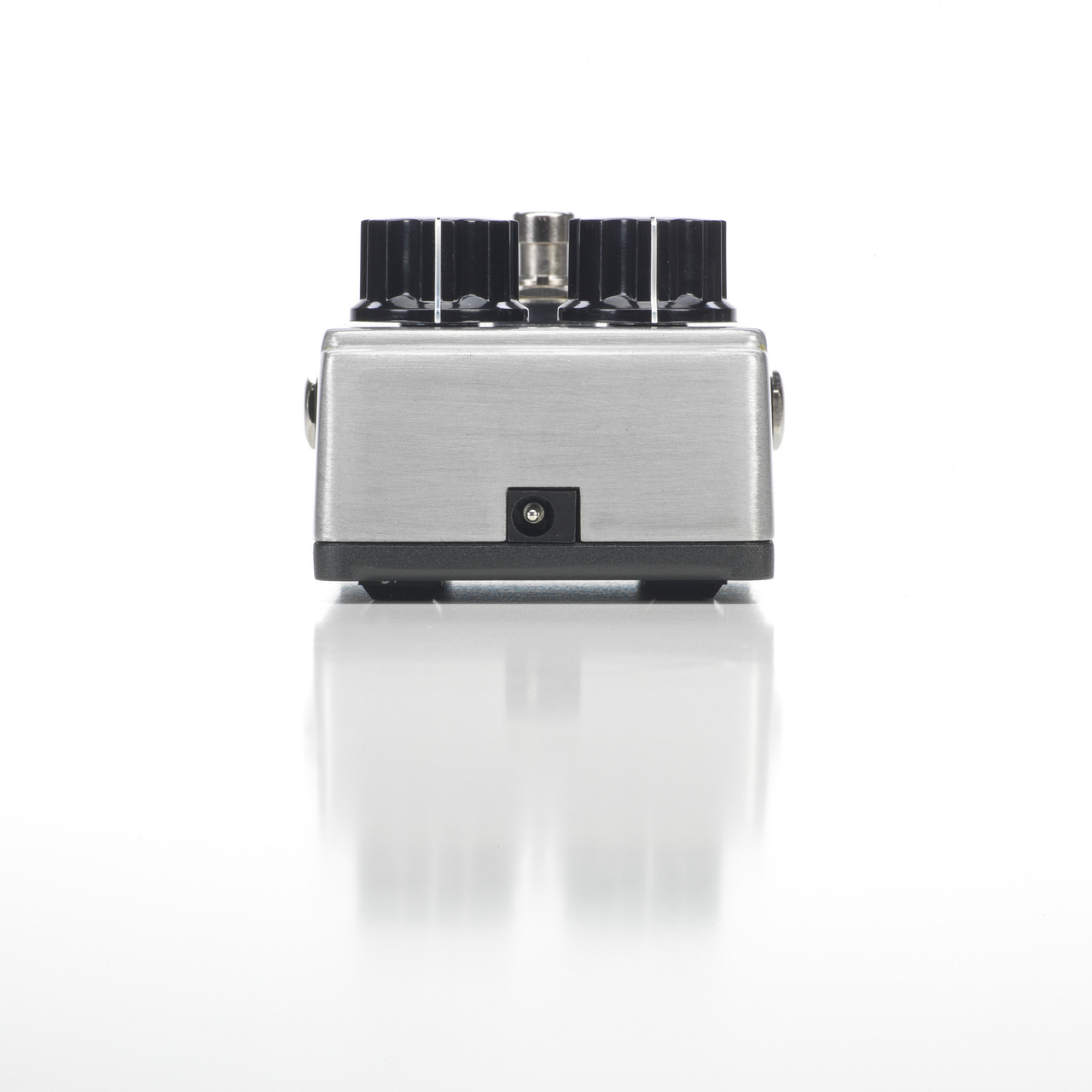 Digitech DOD-GUNSLINGER Mosfet Distortion Pedal featuring rugged silver housing, dual-level controls, and warm tube-like distortion perfect for modern rock and metal tones.