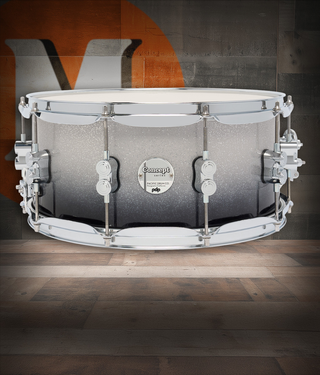 PDP Concept Maple 6.5x14 Snare Drum in Silver to Black Sparkle Fade Lacquer finish with maple shell and chrome hardware, delivering powerful tone and striking visual appeal.