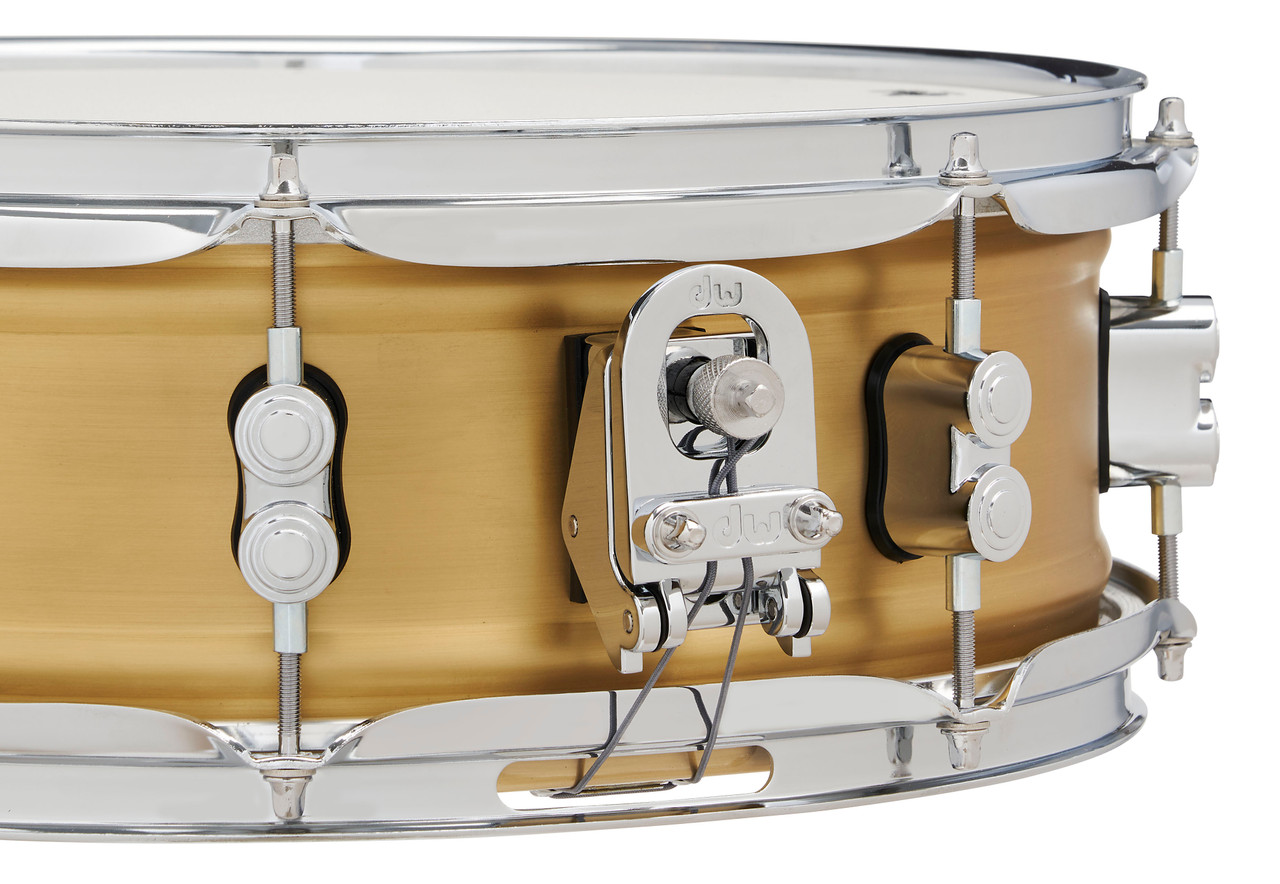 PDP Concept Series 5x14 Snare Drum in Natural Satin Brushed Brass with 1.2mm shell and chrome hardware, producing warm, punchy tone with elegant brushed finish.