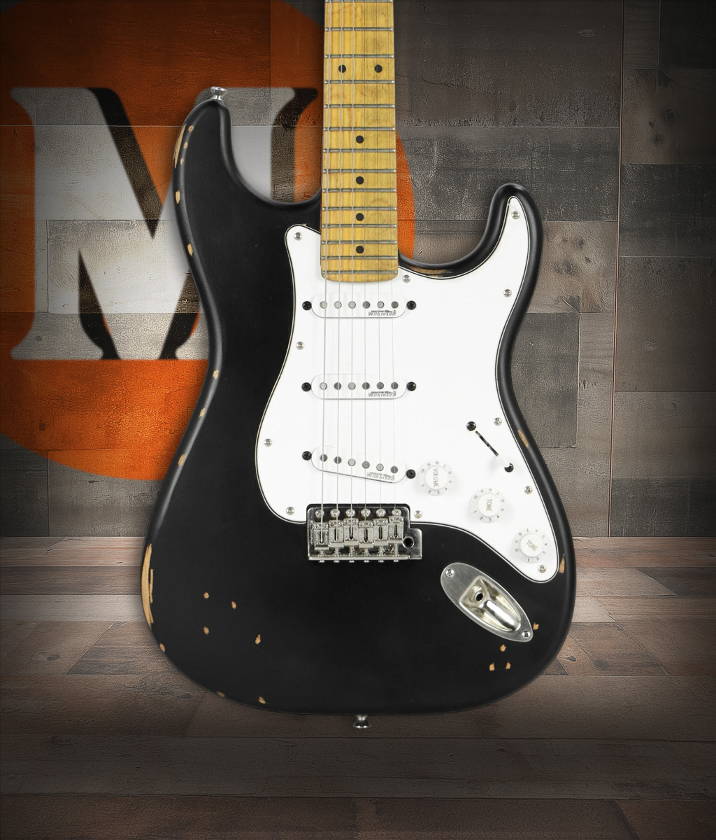 Vintage V6 ICON Electric Guitar in Distressed Boulevard Black featuring aged relic-style finish, Wilkinson hardware and pickups, contoured body, smooth neck profile, and classic vintage-inspired tone.