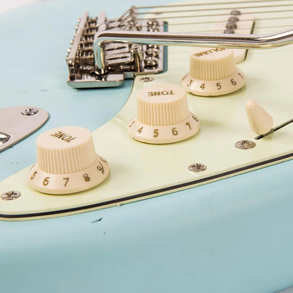 Vintage V6 ICON Electric Guitar in Distressed Laguna Blue featuring a relic-style finish, Wilkinson hardware and pickups, contoured body, smooth neck profile, and classic vintage-influenced tonal character.