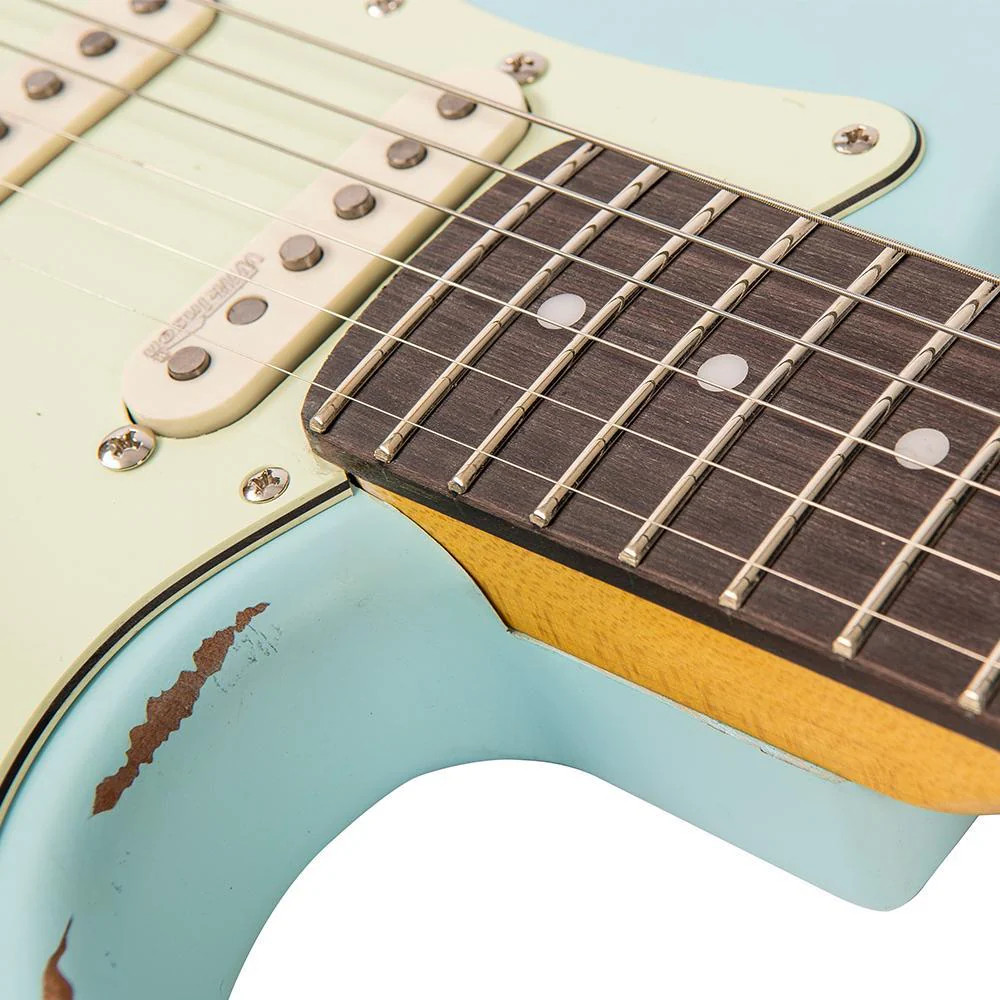 Vintage V6 ICON Electric Guitar in Distressed Laguna Blue featuring a relic-style finish, Wilkinson hardware and pickups, contoured body, smooth neck profile, and classic vintage-influenced tonal character.