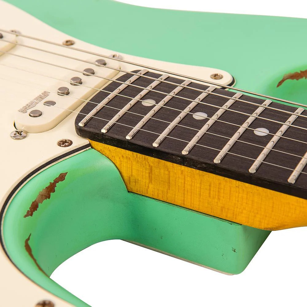 Vintage V6 ICON Electric Guitar in Distressed Ventura Green featuring a relic-style aged finish, Wilkinson hardware and pickups, contoured body, smooth neck profile, and warm vintage-inspired tonal character.