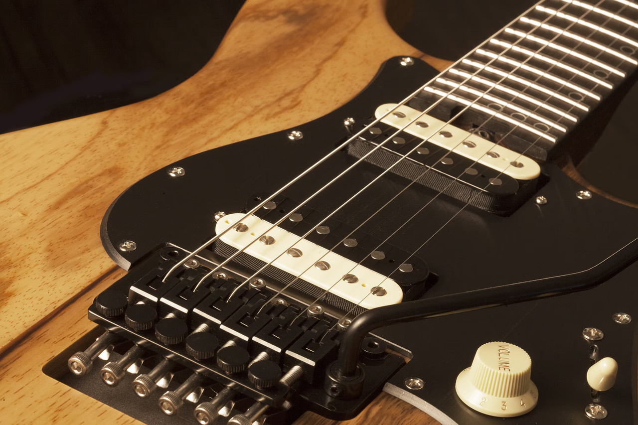 Schecter Sun Valley Super Shredder Exotic FR â€“ Natural Satin (1265) featuring exotic wood top, Floyd Rose locking tremolo, roasted maple neck, and high-output pickups for modern shred performance.