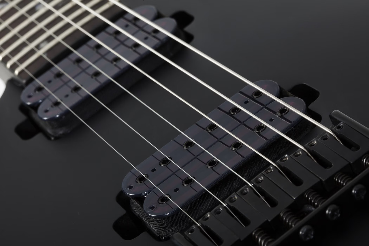 Schecter Damien-6 Left-Handed â€“ Satin Black (2473) featuring high-output pickups, arched top body, fast maple neck, and sleek satin black finish designed for modern heavy playing.