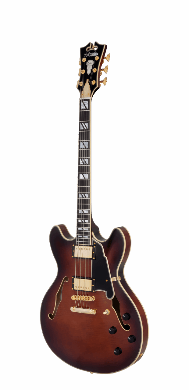 The DÃ¢â‚¬â„¢Angelico DAEDCARBGS Double Cutaway Electric Guitar features a warm, vintage-inspired Amaretto Burst finish paired with a classic double-cut body design. A stop-bar tailpiece enhances sustain and tuning stability, while refined DÃ¢â‚¬â„¢Angelico craftsmanship ensures smooth playability and expressive tone. Ideal for players seeking a versatile instrument capable of blues, jazz, rock, and modern styles.