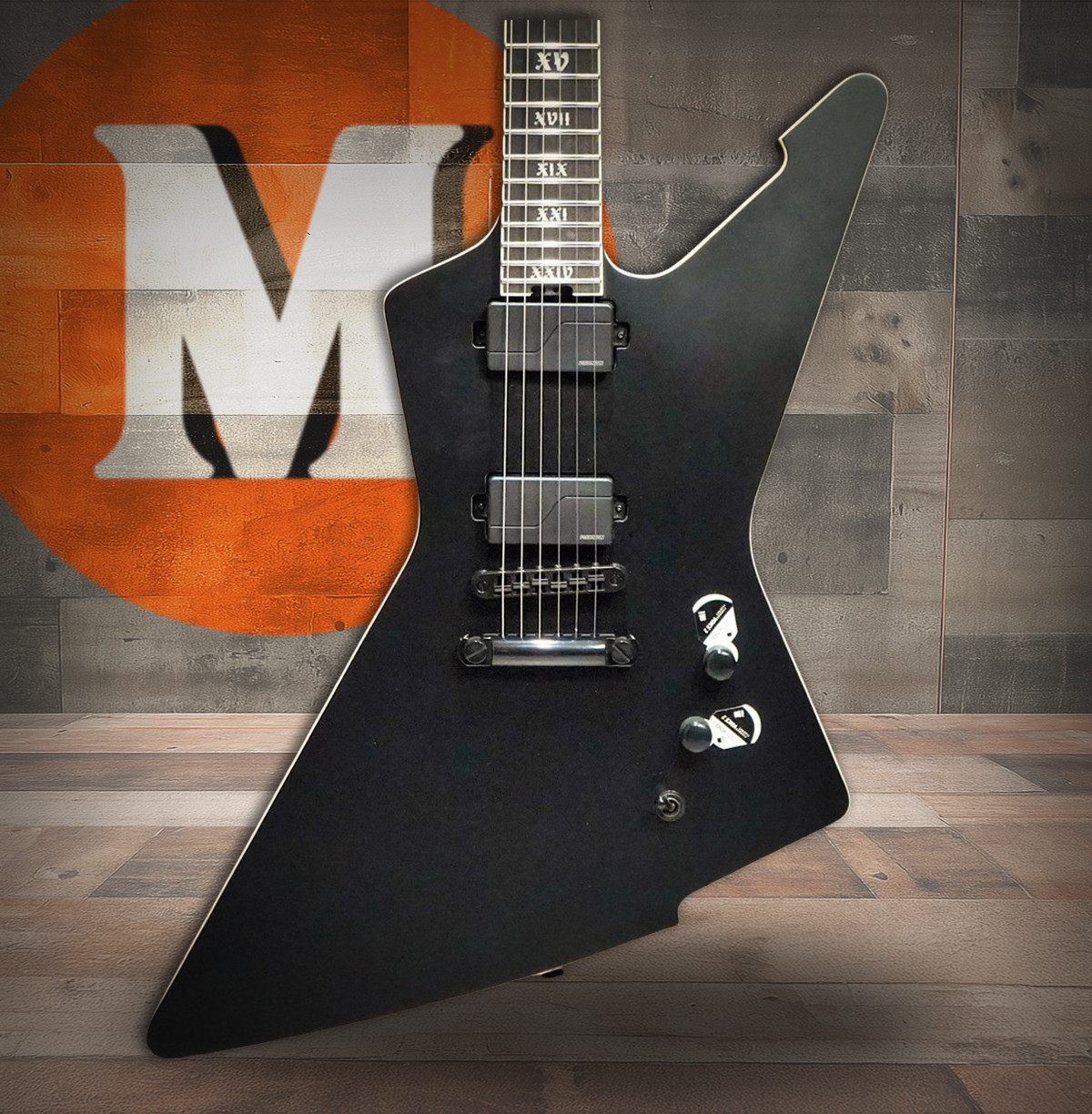 Schecter E-1 SLS Evil Twin electric guitar in Satin Black featuring an angular body design, ultra-thin neck profile, high-output humbuckers, premium SLS construction, and modern blacked-out hardware.