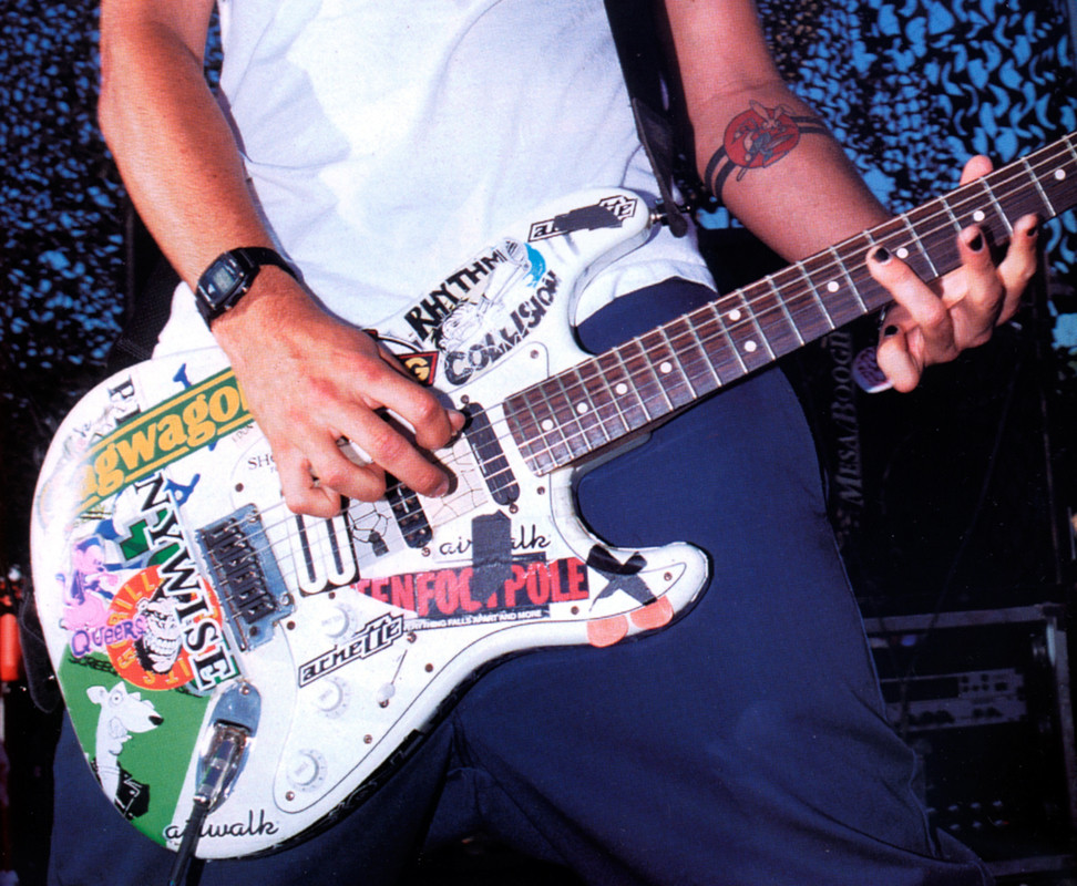 Fender Squier Stratocaster Tom DeLonge Sticker Strat Electric Guitar in Olympic White delivers classic Strat tone with a bold, tour-inspired custom look. Shop at Musician Madness.