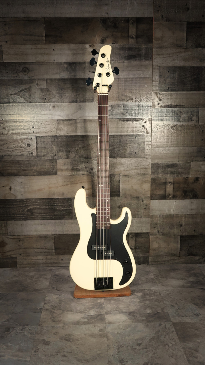 Schecter P-5 Ivy 5-string electric bass featuring a sleek ivy green finish, classic P-style body, powerful pickups, smooth-playing neck, and extended low-range performance.