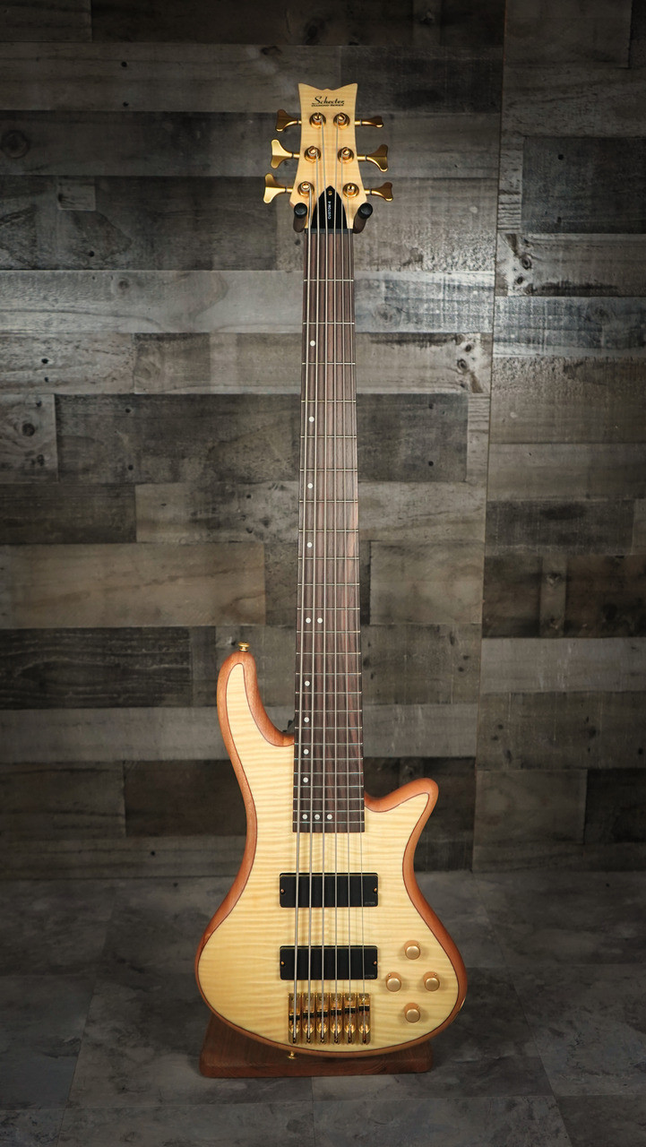 Schecter Stiletto Custom-6 Bass Guitar – Natural Satin (NAT) finish featuring 6-string design, EMG pickups, active 3-band EQ, and contoured mahogany body for smooth, powerful tone and modern versatility