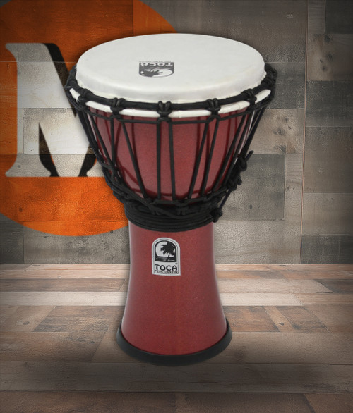 The Toca Freestyle Colorsound 7" Djembe (TFCDJ-7MR) features a durable, lightweight synthetic shell with a pre-stretched head for consistent tone and easy maintenance. Its metallic red finish provides bright visual appeal, while the compact size makes it ideal for kids, travel, classrooms, and casual percussionists. Produces clear slaps and warm bass tones with minimal effort.