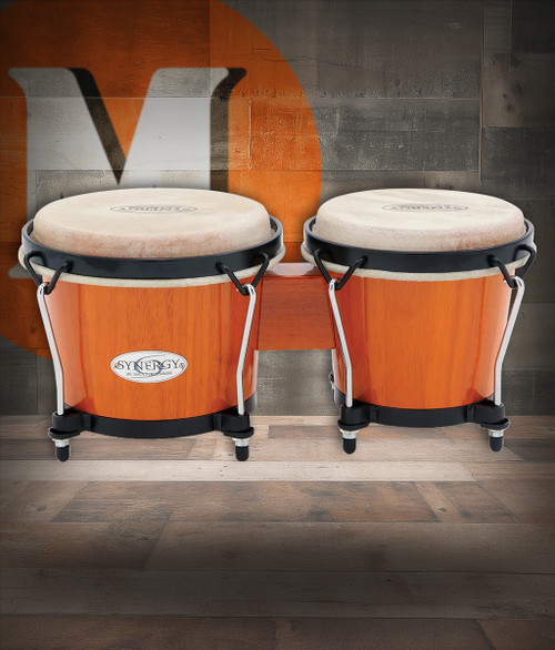 The Toca Synergy Bongos (2100AMB) feature 6" and 6-3/4" shells crafted from lightweight yet durable materials, producing warm, vibrant tones with excellent projection. Finished in a rich amber color with black hardware, these bongos offer comfortable playability and are ideal for beginners, students, and casual performers.