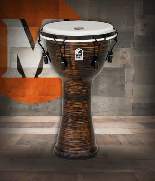 The Toca Freestyle II Mechanical Tune Djembe (TF2DM-10SC) features a 10" synthetic shell with a durable spun copper finish. Equipped with mechanical tuning hardware for fast, precise adjustments, this djembe delivers deep bass tones, sharp slaps, and consistent projection. Lightweight and weather-resistant, i-s ideal for drum circles, education, outdoor use, and traveling musicians.