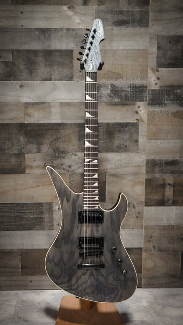 The Schecter Avenger Standard (3964) features a striking offset Avenger body finished in smooth Charcoal Satin. Equipped with powerful Diamond Series humbuckers, a thin-C neck for fast playability, and stable hardware, this guitar is built for aggressive riffing, soaring leads, and modern high-gain tones. Ideal for rock and metal players seeking performance-driven design with bold aesthetics.