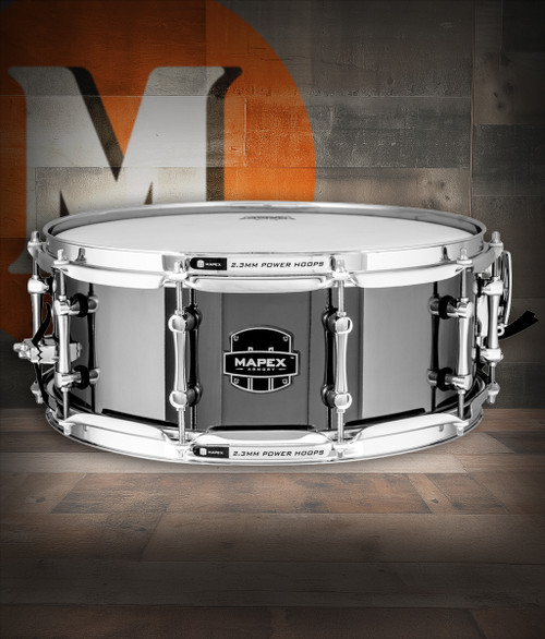 Mapex Armory 14" x 5.5" Tomahawk Snare Drum – Black Chrome (ARST4551CEB) featuring a steel shell, black chrome finish, and cutting tone for powerful, high-impact drumming.